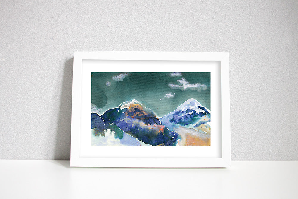 Inky painting of the Annapurna mountains in a white frame.