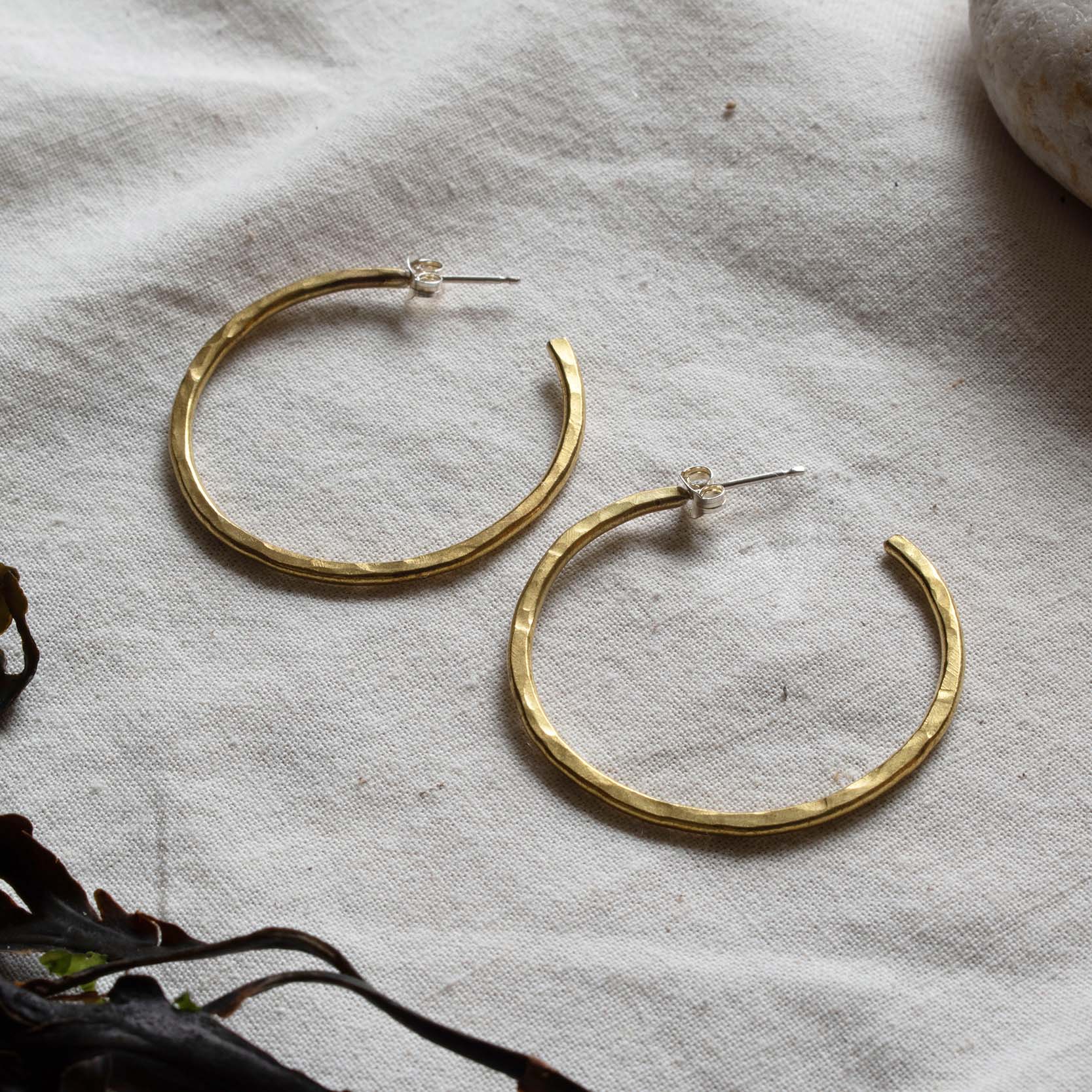 Hammered brass hooped earrings. From Kelpi Studio in Cornwall.