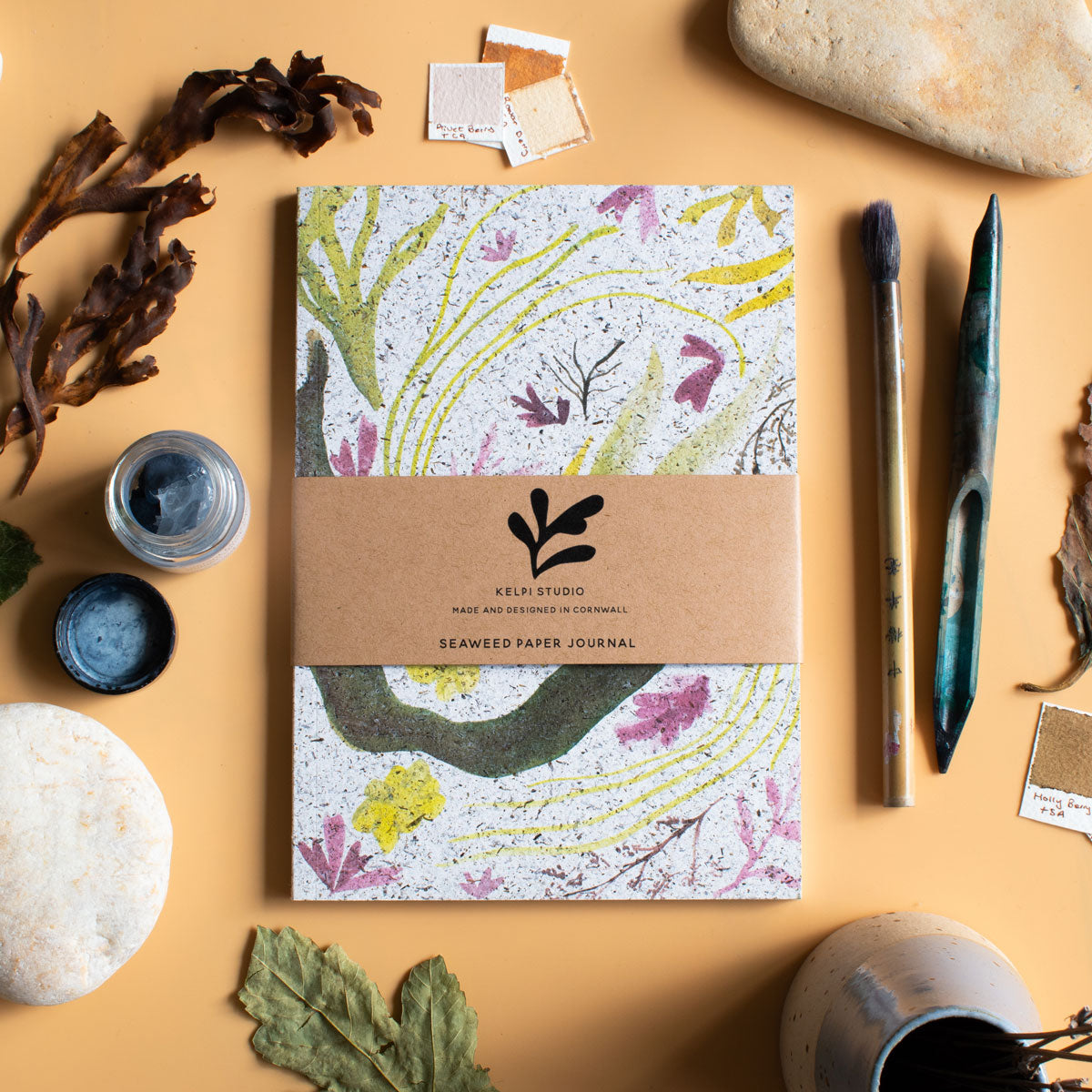 Seaweed journal with a delicate seaweed montage design on an artist's table