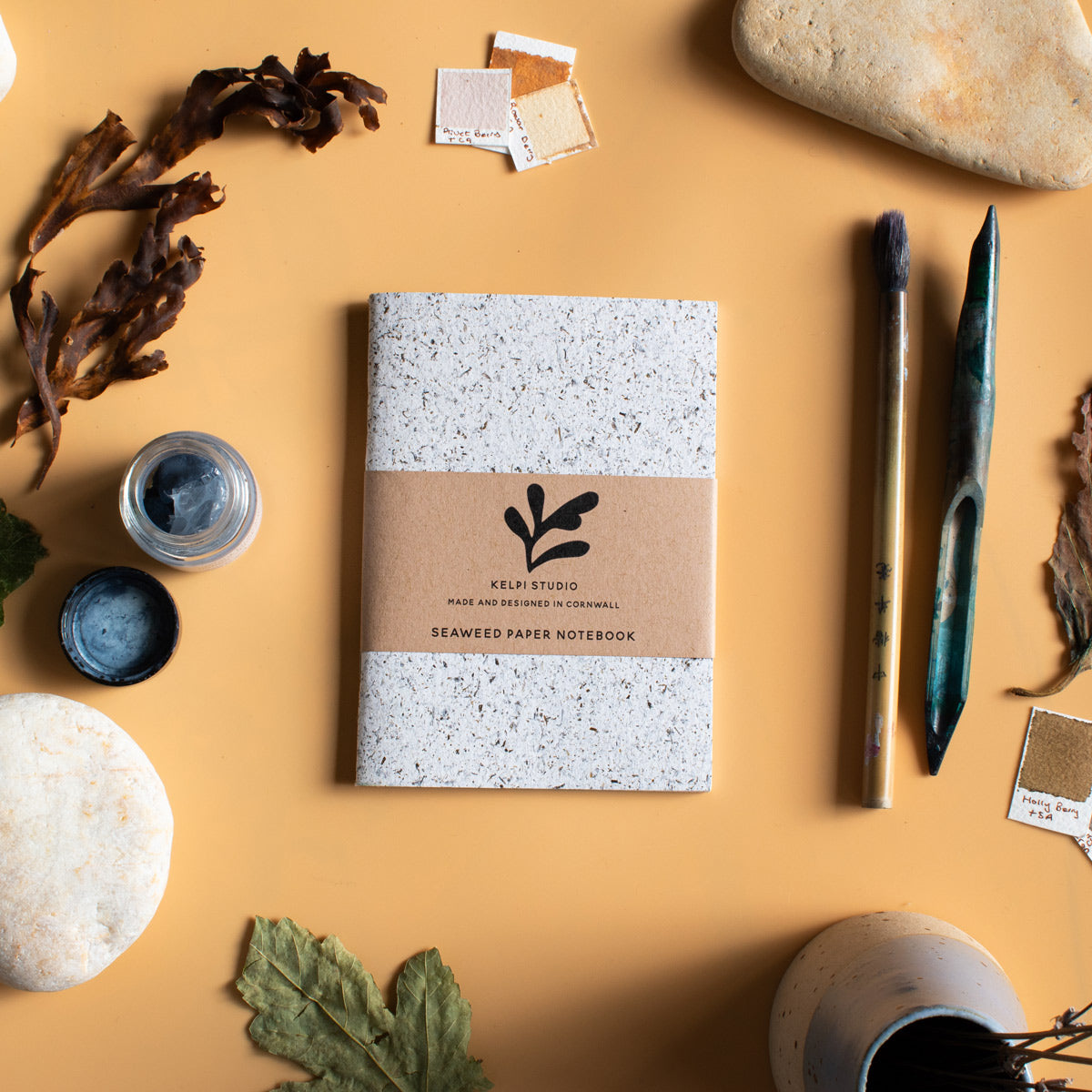 Small notebook made from seaweed on a artist's table