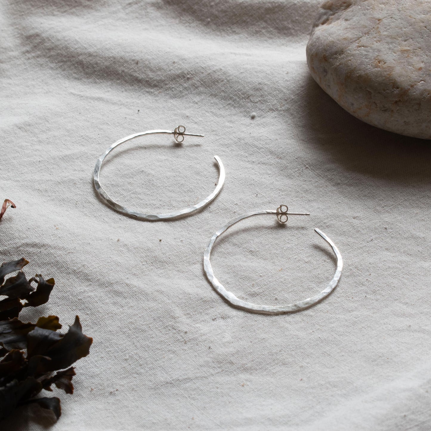 Hammered silver hooped earrings. From Kelpi Studio in Cornwall.