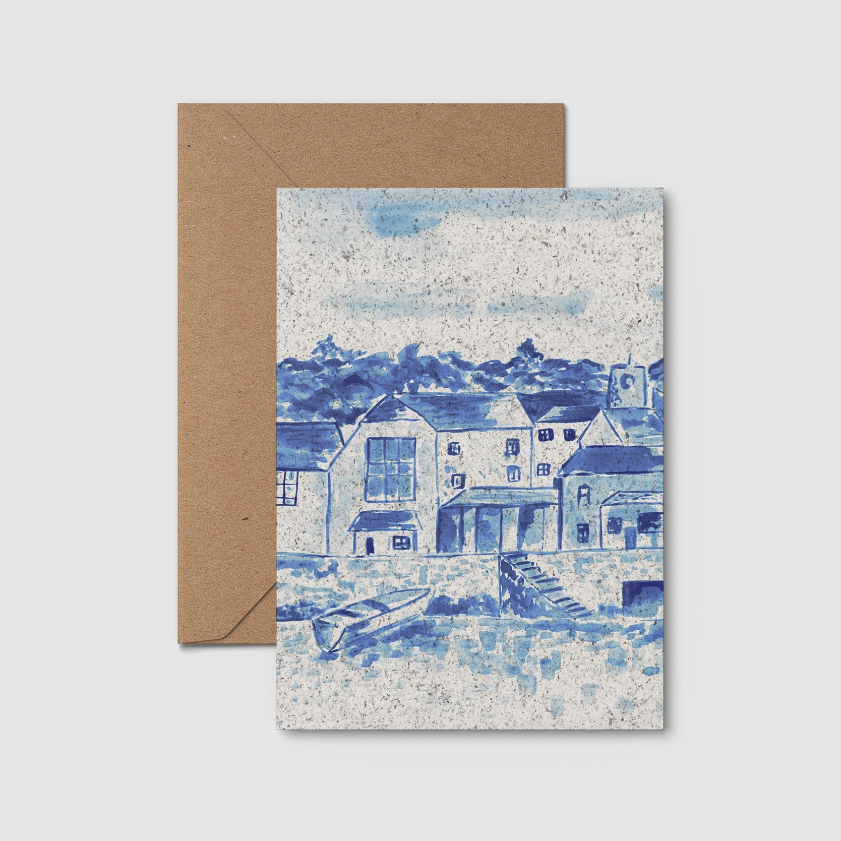 Seaweed Paper greeting card with blue and white illustration of buildings and a brown envelope on a light gray background