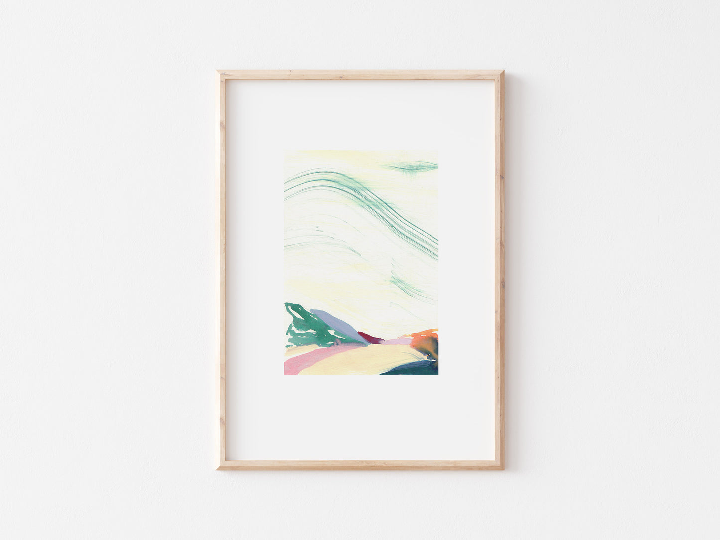 Multi-coloured abstract painting of hills in a wooden frame.