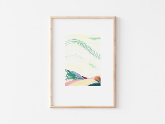 Multi-coloured abstract painting of hills in a wooden frame.