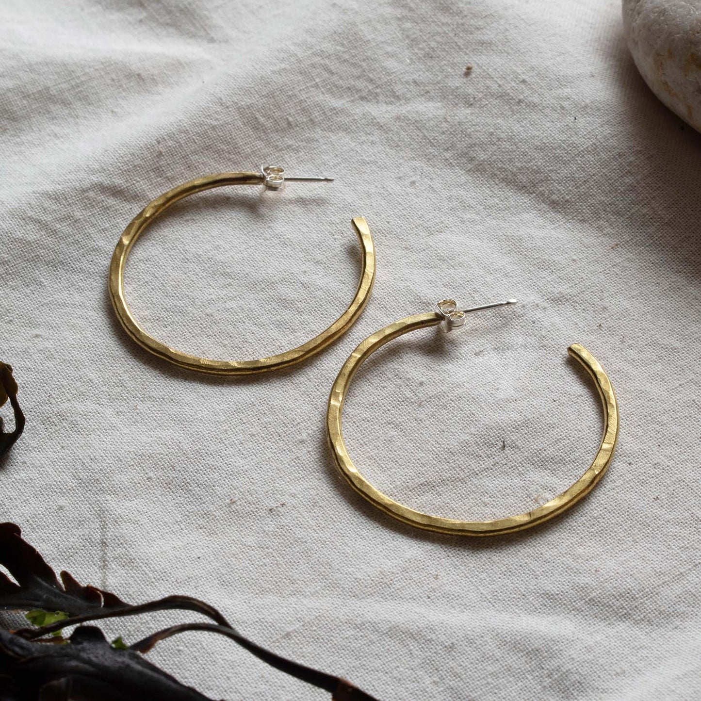 Hammered brass hooped earrings. From Kelpi Studio in Cornwall.