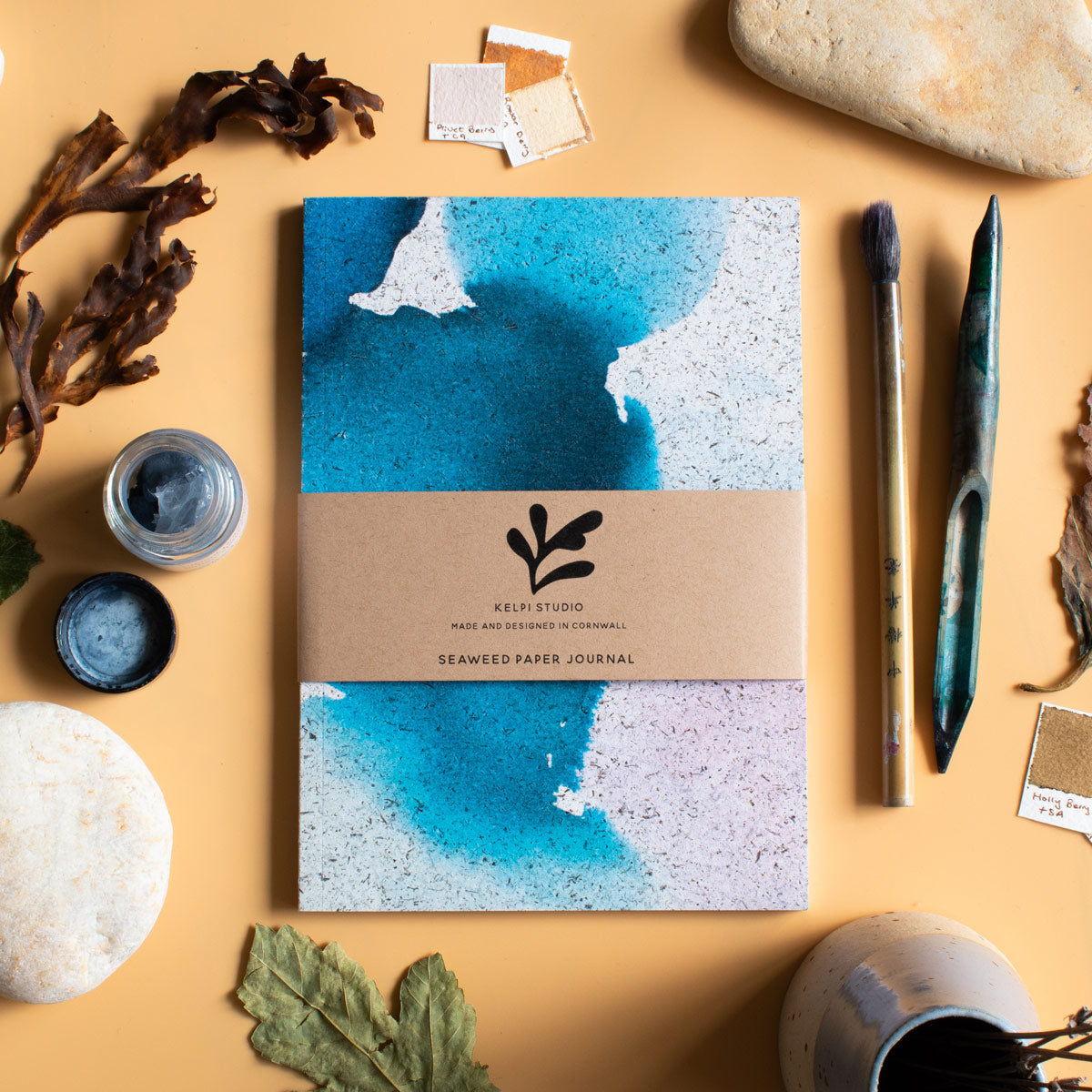 Seaweed journal with an abstract design on an artist's table
