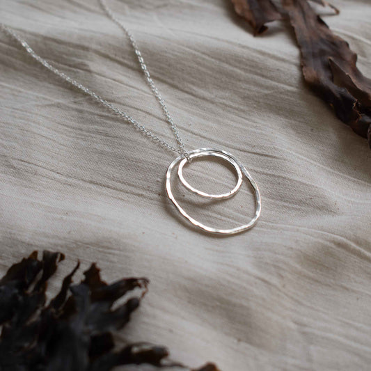 Silver necklace made from two hammered silver hoops
