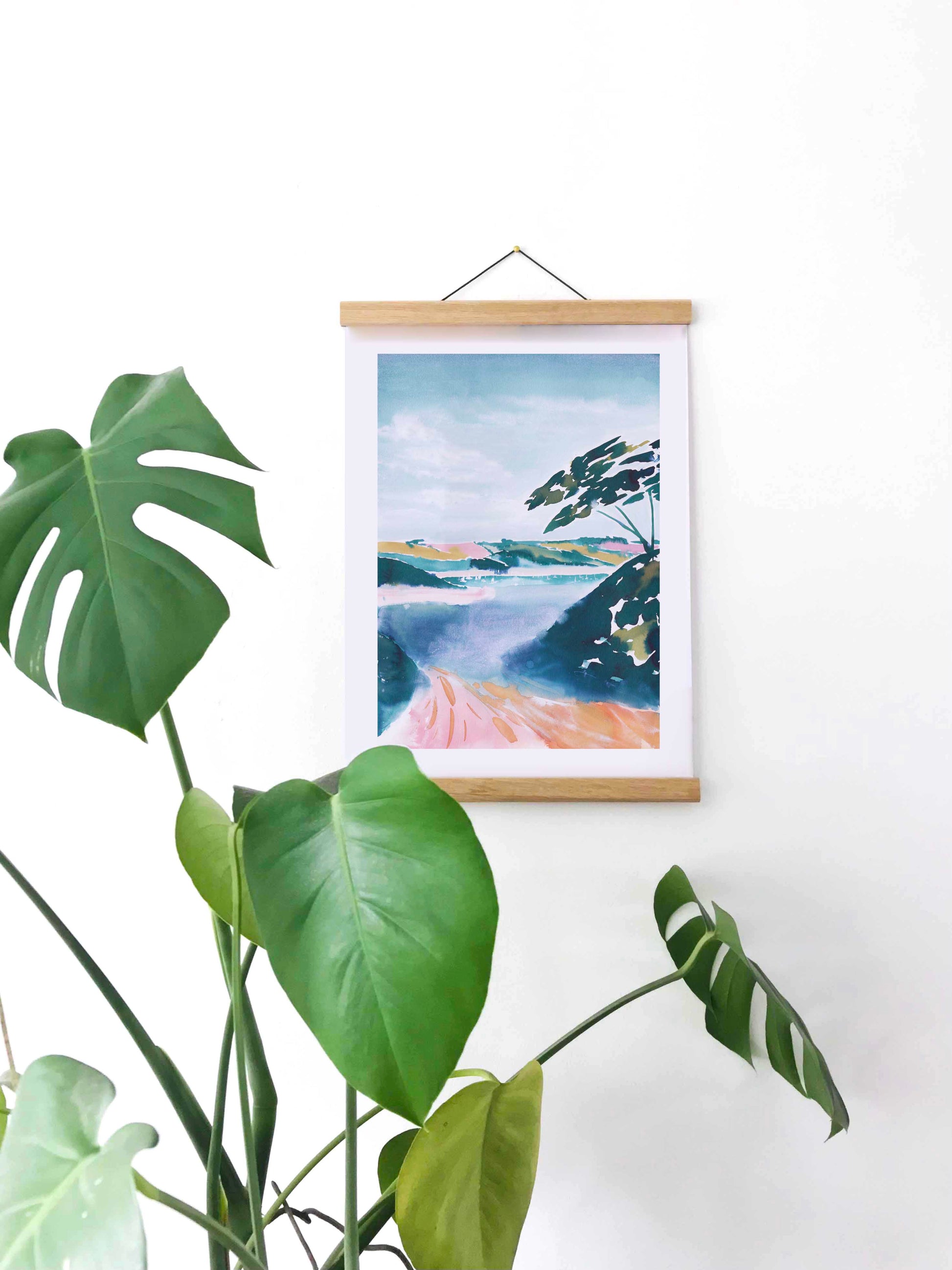 Hanging painted abstract picture of Frenchman's Creek, Helford in Cornwall, UK. From kelpi Studio in Cornwall. WIth cheese plants in the foreground. 