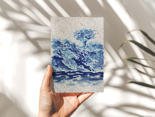 Hand holding a portrait of a painted scene of the Helford in Cornwall. From Kelpi Studio in Cornwall.