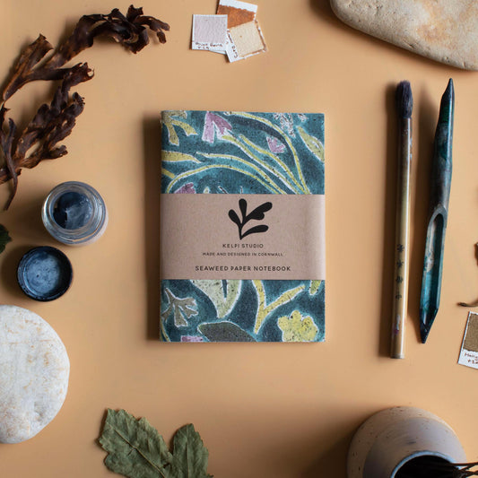 Seaweed paper notebook with a green seaweed design. 