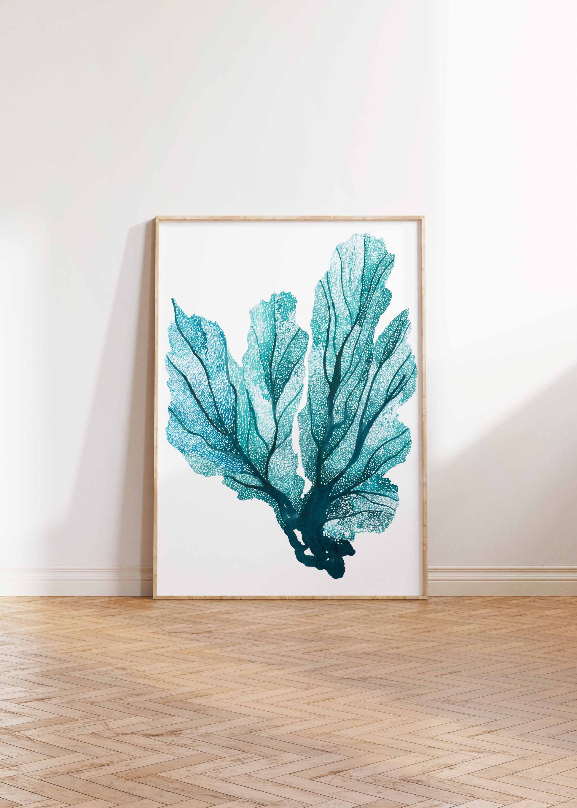 Blue Seafan coral design on recycled paper in a frame.