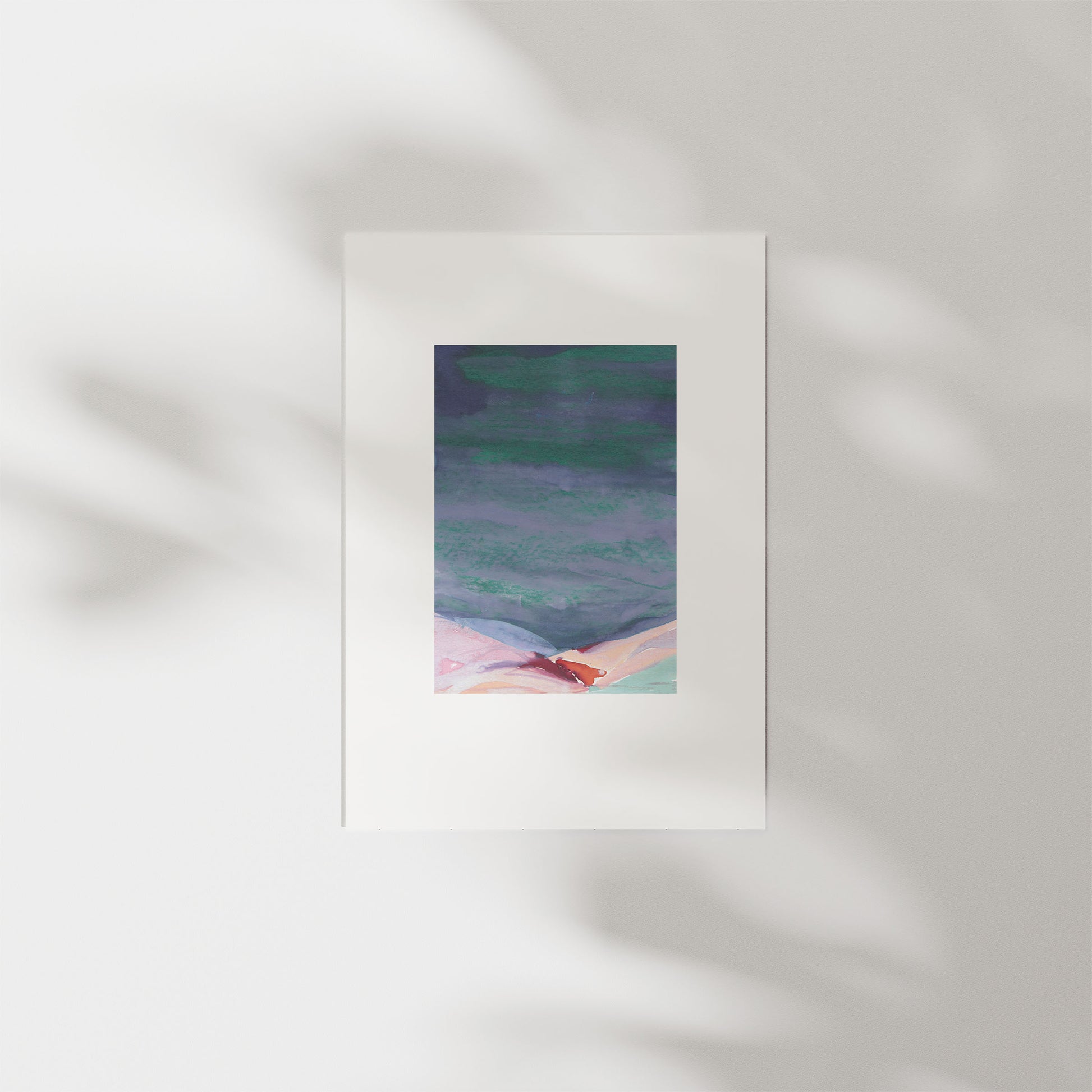 Abstract painting of hills in a wooden frame on a white wall.